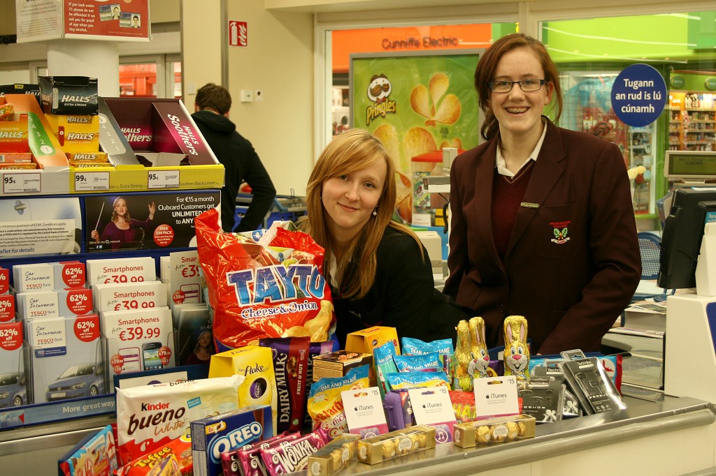 Jennifer Mannion & Magdalena Grochola of the Pres Currylea Green Schools committee with some of the €300 worth of goods sponsored by Tesco for their Green Schools promotions.